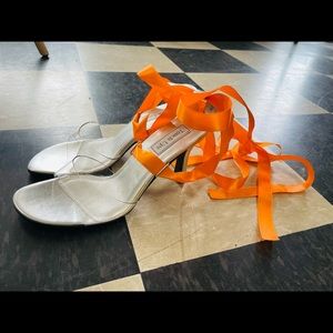 Clear tie up silver heels w/ orange ribbon